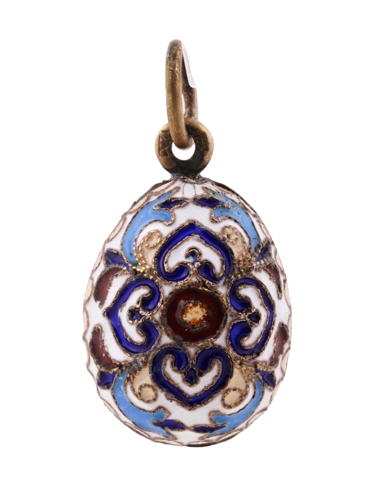 RUSSIAN GILT SILVER CLOISONNE ENAMEL EGG PENDANT: A Russian gilt silver egg-shaped pendant with polychrome cloisonne enamel decor. Elaborate geometrical design. Hallmark of 84 silver standard and makers mark are on the fitting ring. Total Weight: 5.8
