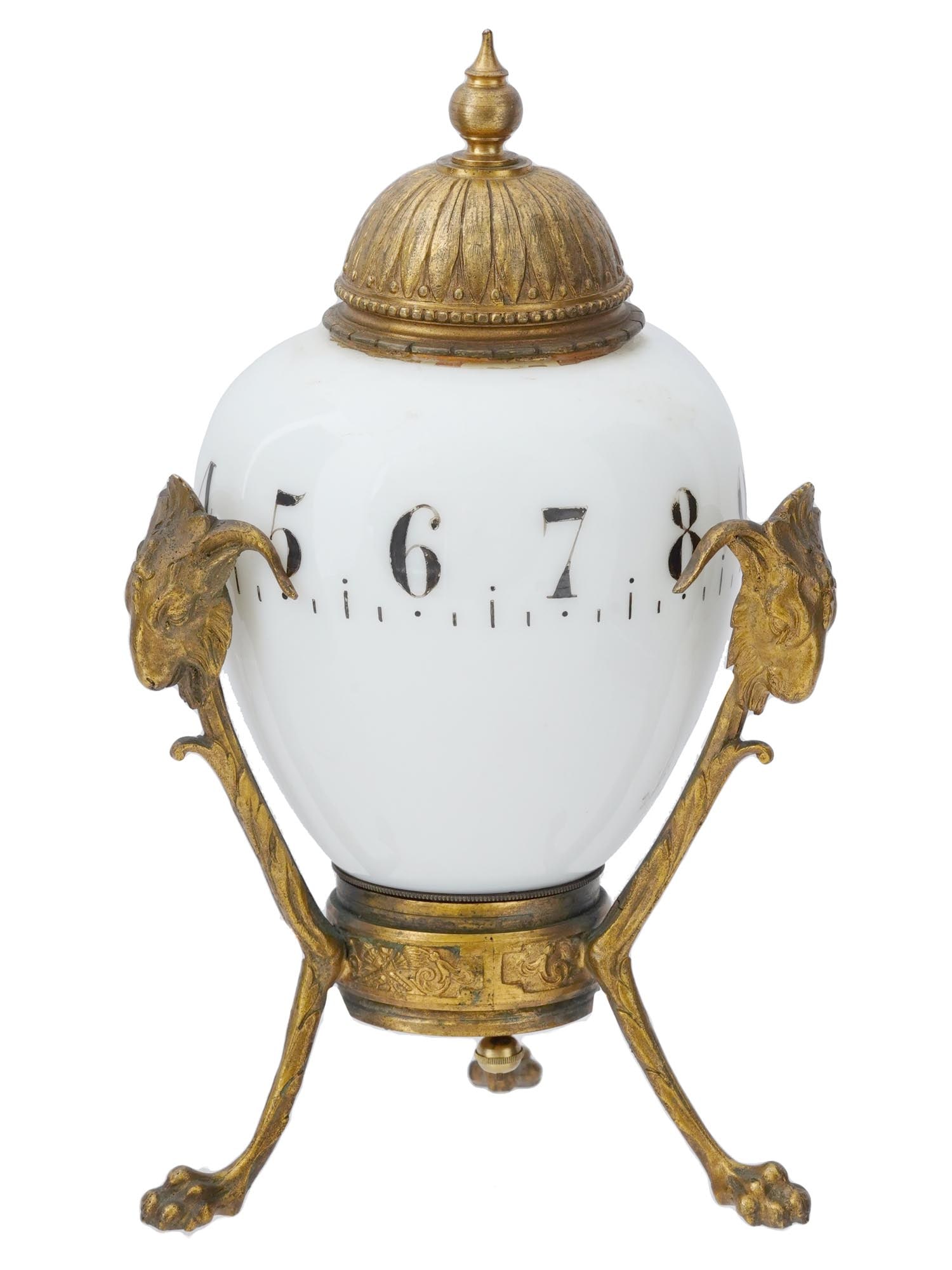 ANTIQUE FRENCH ROTATING BRONZE NIGHT MANTEL CLOCK: An antique French rotating night mantel clock. The central part of the clock is an egg-shaped milk glass, adorned with Arab numerals, adding a touch of sophistication to the design. This central piece
