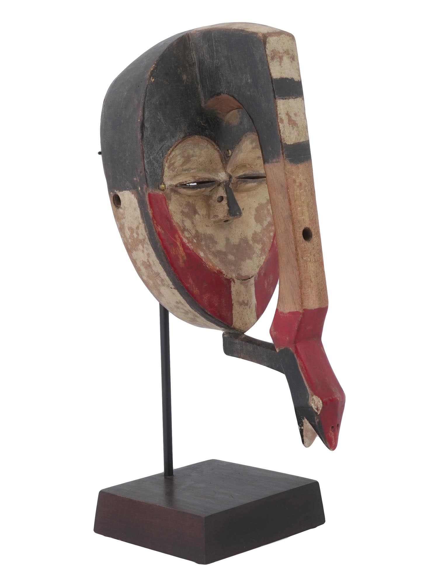 WOODEN MASK OF KWELE PEOPLE GABON CENTRAL AFRICA: A vintage wooden hand carved mask of the Kwele people from Gabon, Central Africa. This mask is of an anthropozoomorphic type, that is, it combines the features of a human and an animal. Such masks are