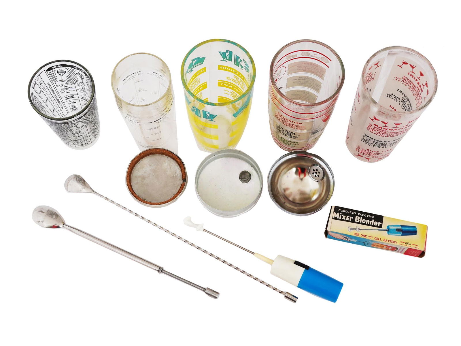 VINTAGE BARWARE COLLECTION COCKTAIL SHAKERS TOOLS: A vintage barware collection including glass cocktail shakers and bar tools. All shakers of the lot have different designs with cocktail recipes depicted on them. A total of 5 pieces, 3 of them with a