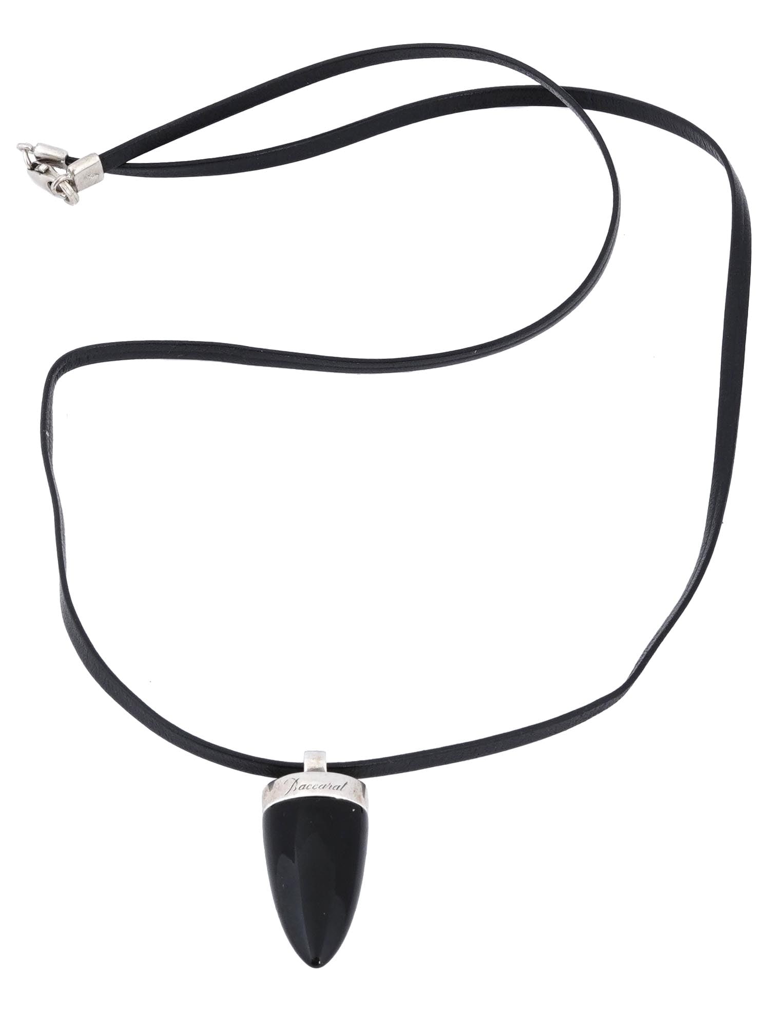 BACCARAT BLACK ONYX SILVER AND LEATHER NECKLACE: A vintage necklace by Baccarat, a French manufacturer of fine crystal. Large polished black onyx pendant with sterling silver mount, marked Baccarat 925. Black leather string with silver clasp. Luxury