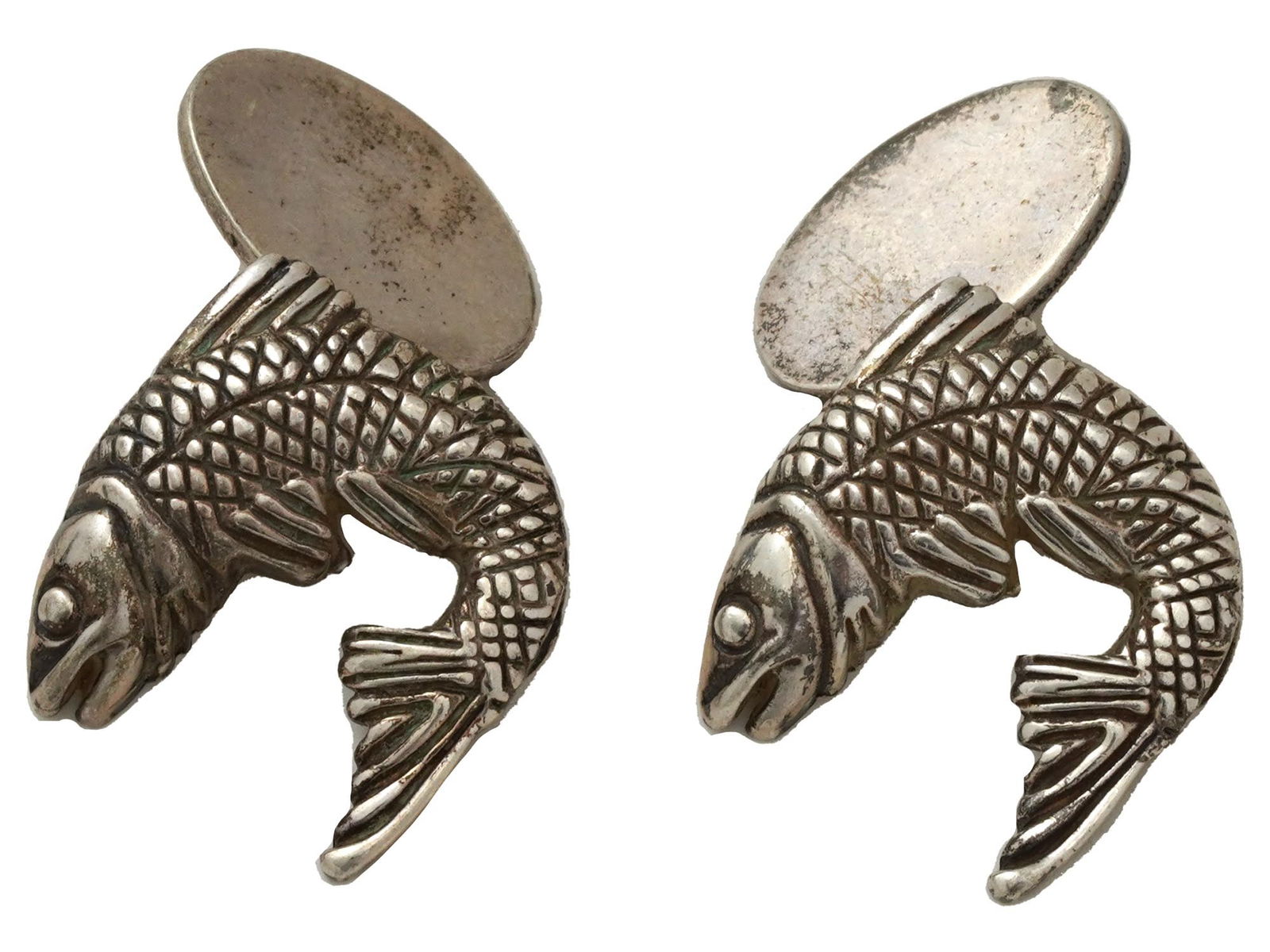 ATTR TO WEBSTER STERLING SILVER FISH FORM CUFFLINKS: A pair of Sterling Silver figural cufflinks, attributed to Stephen Webster. the cufflinks are made in the shape of fish, engraved with detailed patterns. Marked with a Sterling Silver standard hallmar