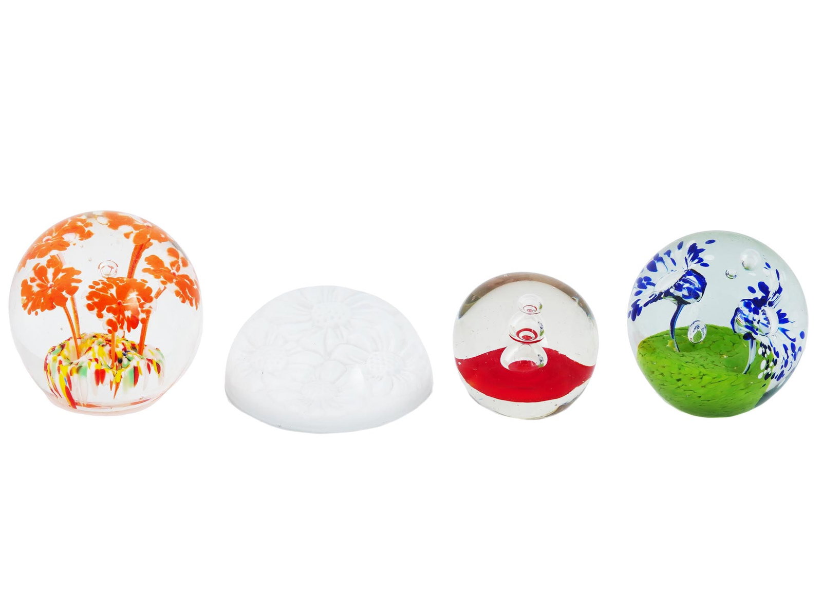 COLLECTION OF MURANO MANNER ART GLASS PAPERWEIGHTS: A collection of four Italian Murano manner art glass paperweights. The collection includes paperweights made in various designs, decorated with yellow and red accents, a floral and bubble motif, and m