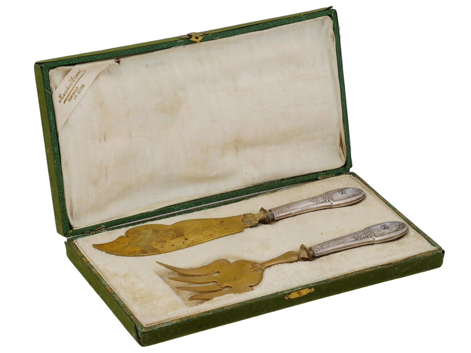 SILVER FISH SET WHICH USED TO BELONG TO HEINRICH HIMMLER: A World War II Nazi German Third Reich fish cutlery set with Sterling Silver handles used to belong to Heinrich Himmler. A total of 2 items, a knife, a fork with a guard. Gilt pierced main parts with 