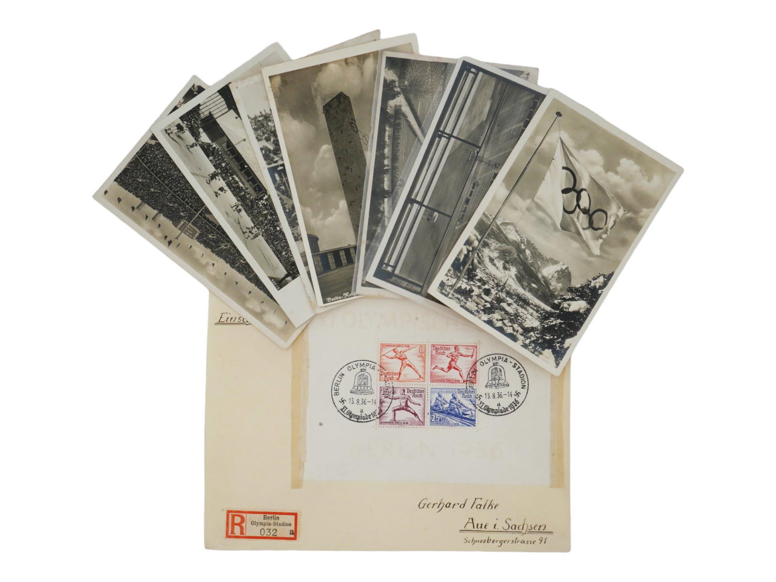 NAZI GERMAN POSTCARDS FROM 1936 BERLIN OLYMPIC GAMES: A collection of eight Nazi German postcards commemorating the 1936 Berlin Olympic Games. Among them are some postcards adorned with stamps. Enclosed within the envelope with stamps dedicated specifica