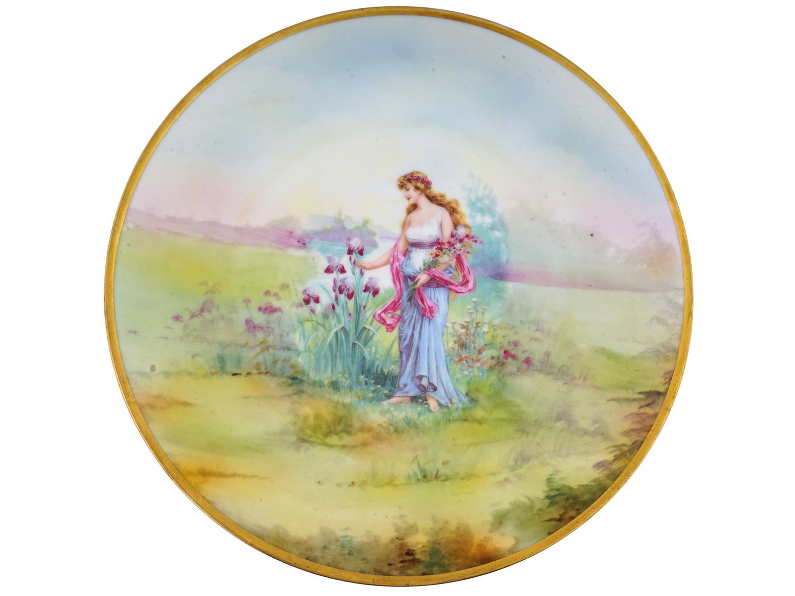 ANTIQUE GERMAN SCHWARZBURG PORCELAIN CABINET PLATE: An early 20th-century porcelain cabinet plate by Schwarzburg Rudolstadt Straus and Sohne, a German porcelain manufacture. The transfer-printed design represents a young woman picking iris flowers in l