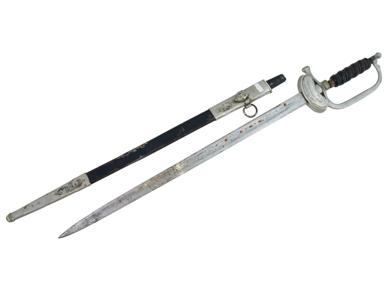 MID CENTURY ARGENTINIAN SABER SWORD WITH SCABBARD: An Argentinian saber sword featuring the guard in maillechort engraved: Coleccion Juan D. Peron San Vicente 1951, and bears a relief coat of arms of Argentina on the other side. Has a metal wire wrapp