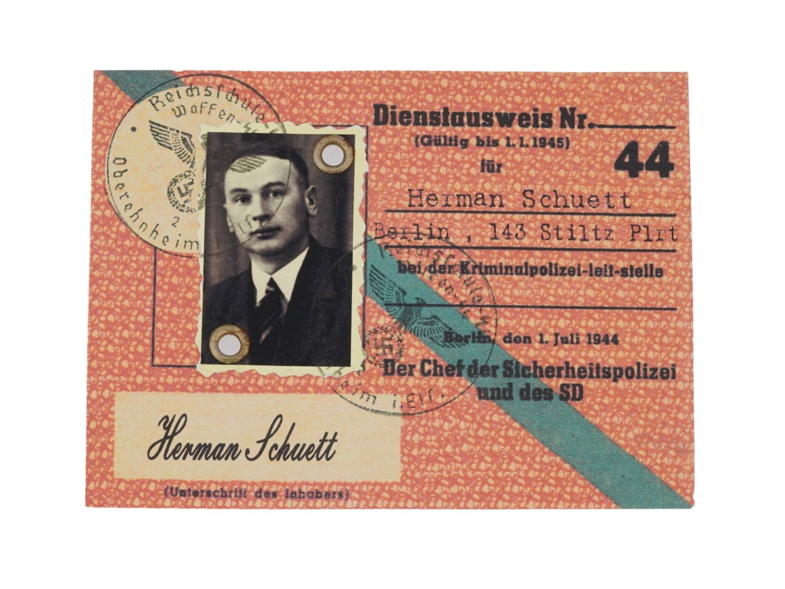GERMAN WWII POLICE IDENTIFICATION DOCUMENT: A WWII Nazi German Ausweis or ID card of the criminal and security police chef in Berlin, Herman Schuett. Stamped, signed, with photograph. Dated July 1, 1944. World War II Historical Collectables And