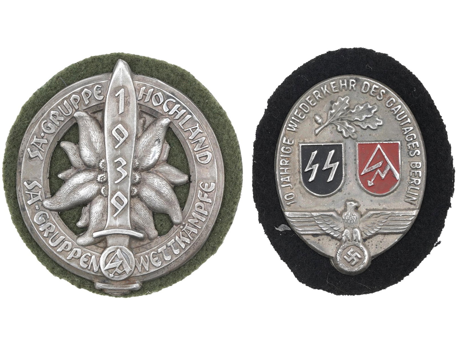 WWII NAZI GERMAN HOCHLAND GAUGES BERLIN SHIELDS: A pair of WWII Nazi German Third Reich enamel metal shields. The first is an SA Gruppe Hochland Rally, decorated with a relief image of an Edelweiss flower, sword, and a SA logo surrounded by the text