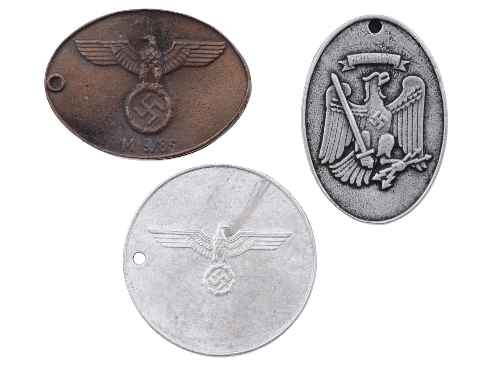 GERMAN WWII THIRD REICH IDENTIFICATION TAGS: A group of three German WWII Gestapo and Police Identification tags: Army Secret Field Police, Prussian State Police and Gestapo. Unauthenticated, sold as is. Second World War Third Reich Historical C