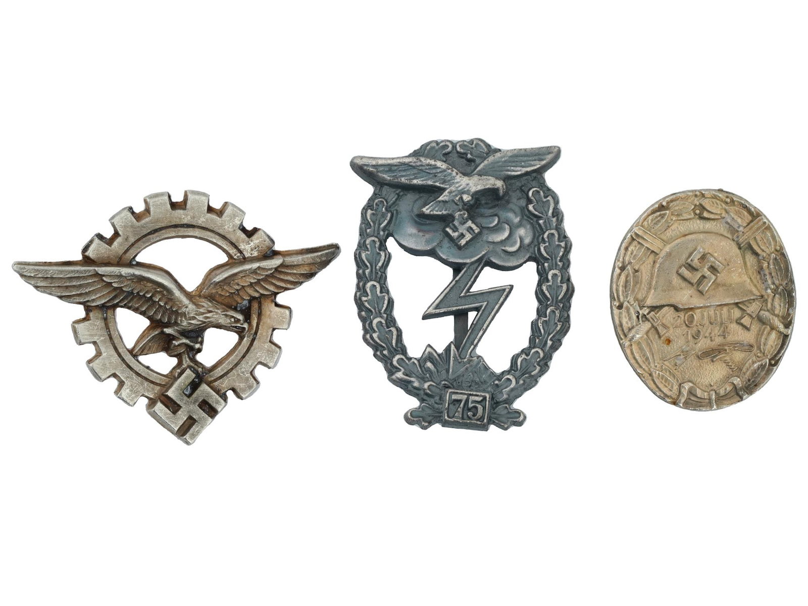 GROUP OF THREE GERMAN WWII MODEL BADGES: A lot of three WWII type Nazi German military decorations. Luftwaffe Ground Assault for 75 assaults. July 20, 1944 Wound badge. Luftwaffe General Aircraft Master. World War II Historical Collectables 