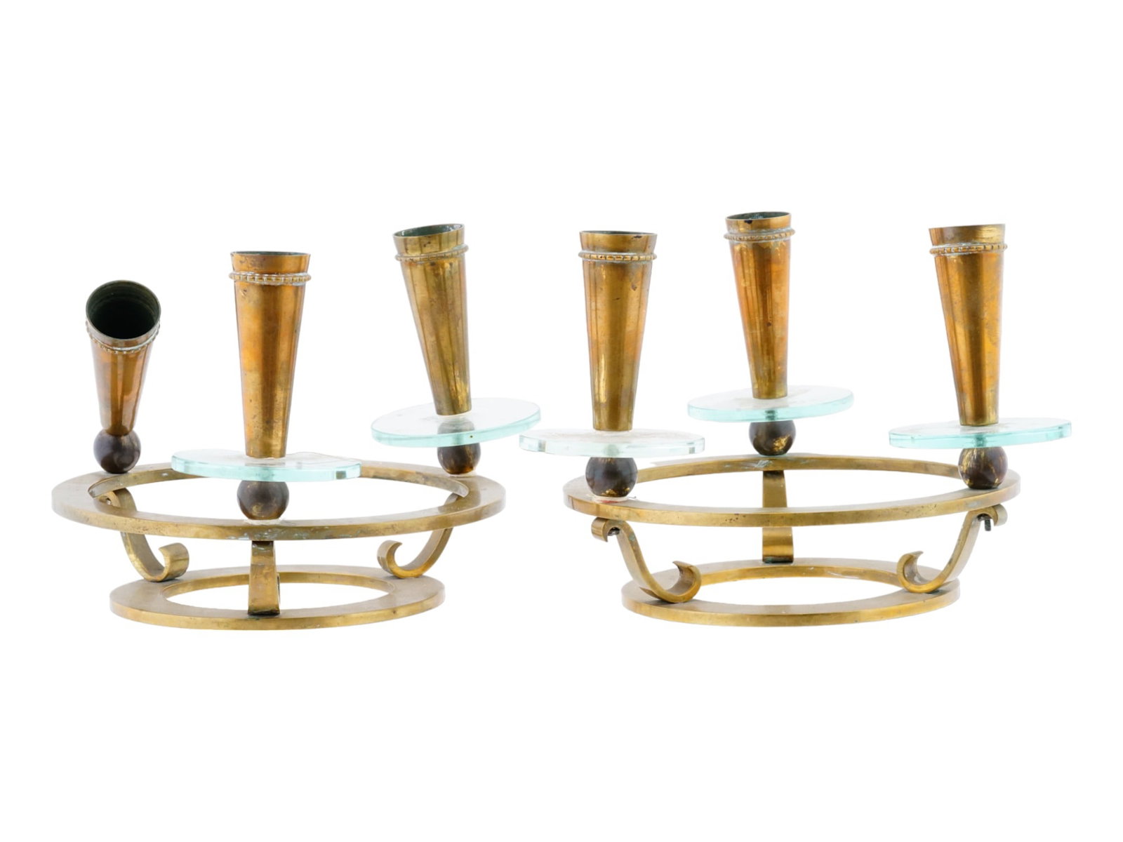 PAIR OF VINTAGE MODERNIST CANDLEHOLDERS: A pair of vintage modernist candleholders standing as a testament to sleek design and functional artistry. Comprising three tall capitals with transparent wax plates, the holders boast a minimalist el