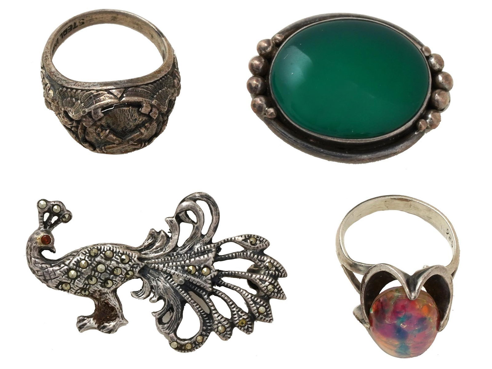GROUP OF STERLING SILVER SCULPTURAL JEWELRY WARES: A collection of four Sterling Silver sculptural jewelry wares. The collection includes a figural brooch made in the shape of a peacock encrusted with Marcasite stones and decorated with pierced throug