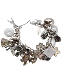 VINTAGE STERLING SILVER BRACELET WITH VARIOUS CHARMS