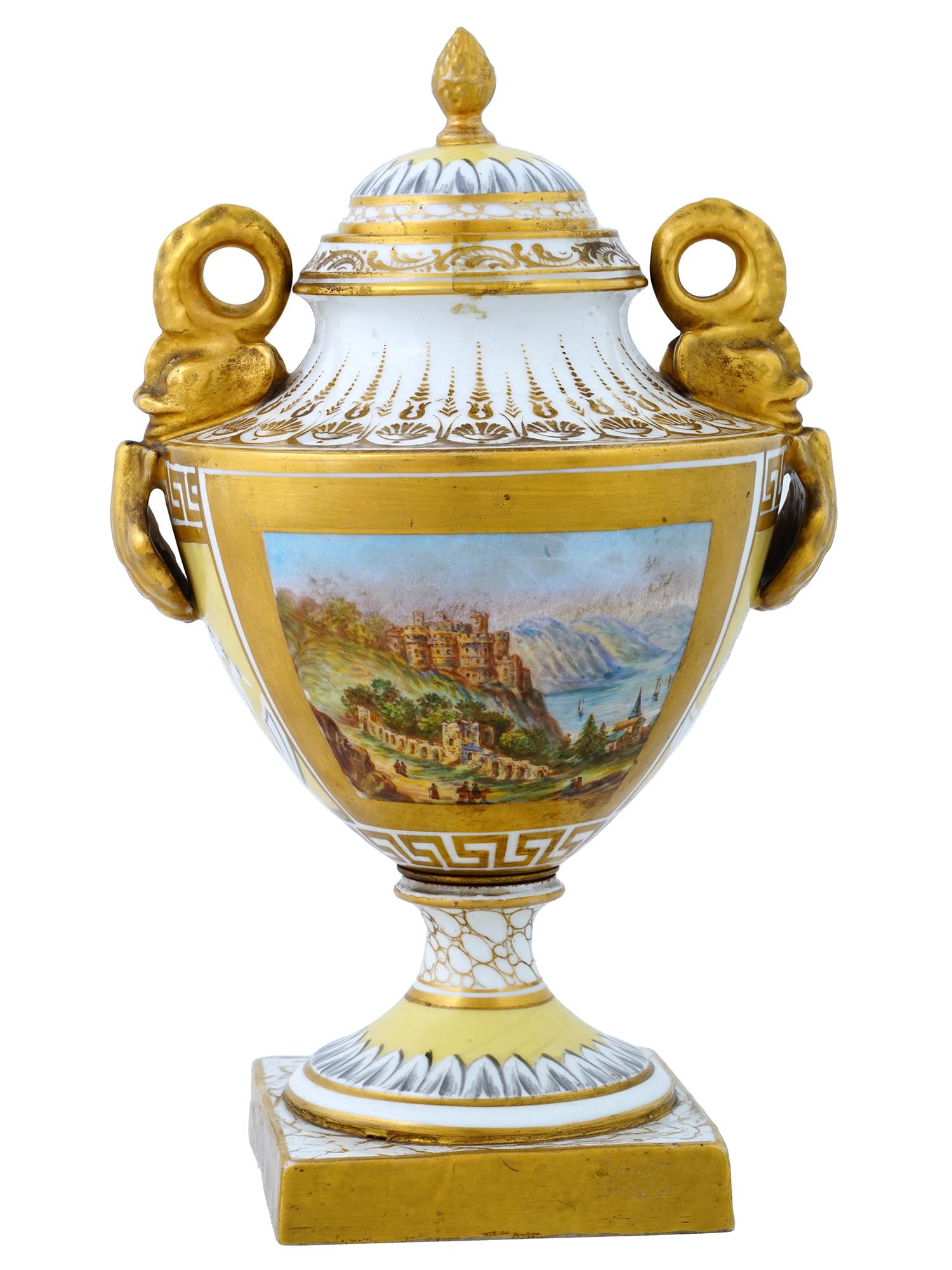 ANTIQUE GILT PORCELAIN CLASSIC DESIGN AMPHORA VASE: An antique porcelain vase of classic design, presenting an amphora form on a square base, complete with a lid and distinctive dolphin and shell handles. The lid, adorned with a cone knob, complements