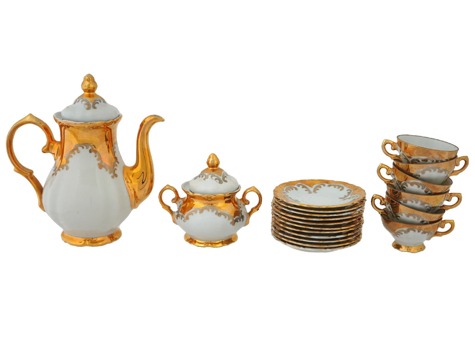 VINTAGE GERMAN BAVARIA BONE CHINA COFFEE SERVICE: A vintage German bone china coffee service. A total of 19 items, a coffee pot, a sugar bowl, 6 cups and 11 saucers. Richly gilded. Each piece has a crowned Bavaria hallmark on the bottom. Presumably b
