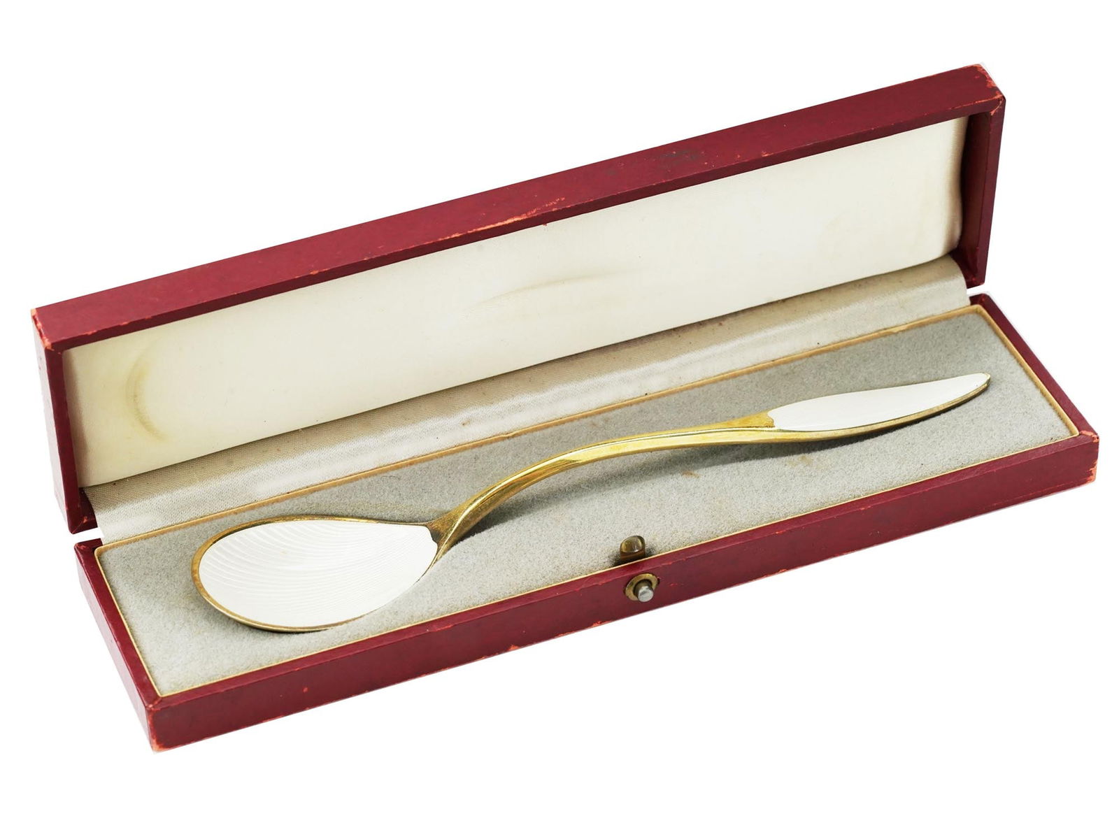 FRIGAST DENMARK GILT STERLING SILVER ENAMEL SPOON: A Danish gilt sterling silver tea spoon. White guilloche enamel bowl and handle. Marked Frigast Sterling Denmark on the handle. Total Weight: 40 grams. The item comes in original box. Poul Frigast was