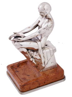 FRENCH ART DECO GIRL FIGURE BY MAX LE VERRIER: An Art Deco nickel plated female figure by Max Le Verrier. The girl figure with a short haircut is presented in a geometric pose with raised knees, holding in her hands a round object without a bottom