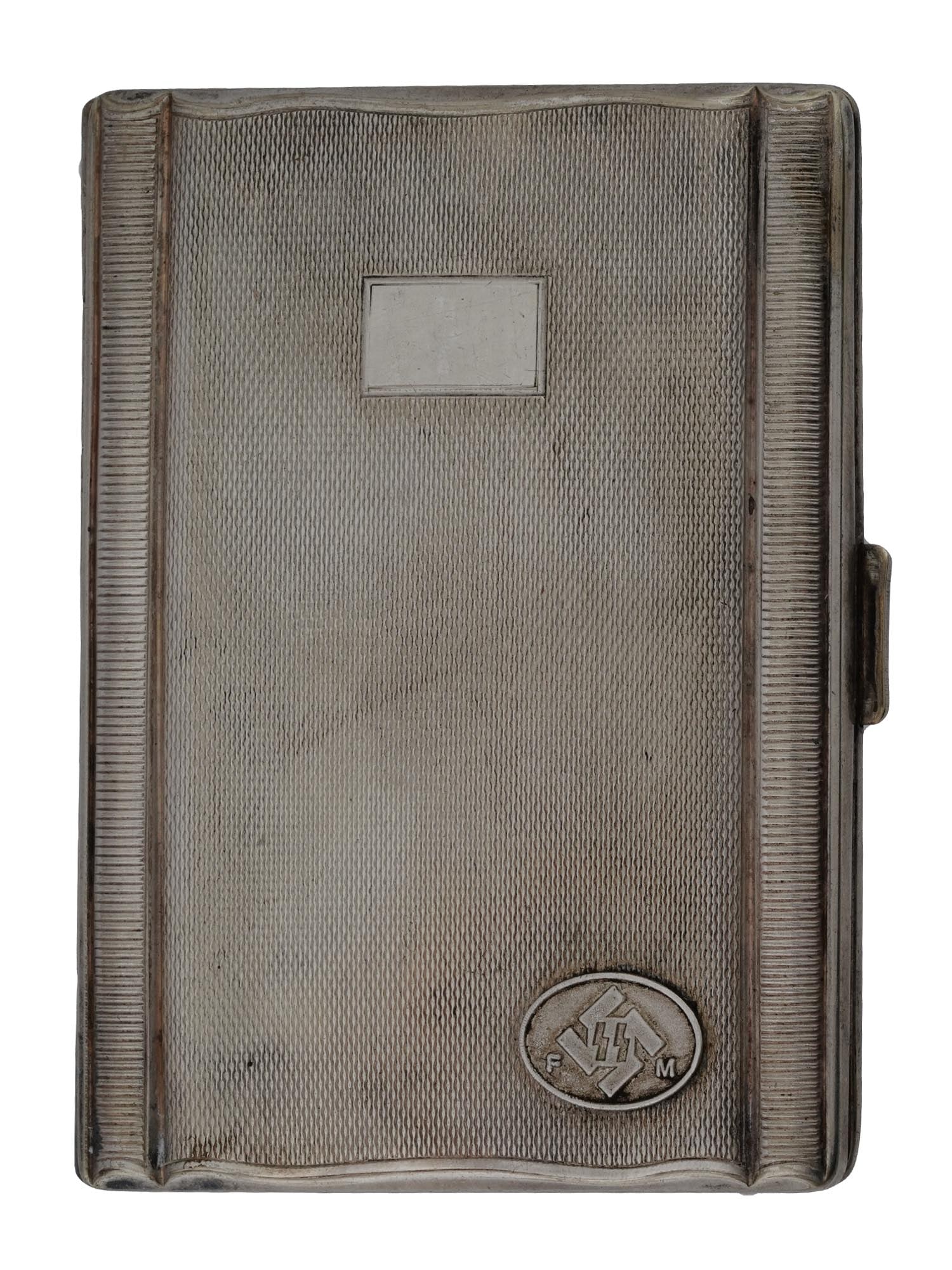 WWII NAZI GERMAN TYPE FM WAFFEN SS CIGARETTE CASE: A WWII Nazi German Third Reich type cigarette case. The case is silver plated metal alloy construction. Gold washed inside. The case is adorned with an oval shaped plaque featuring FM SS runes on a sw