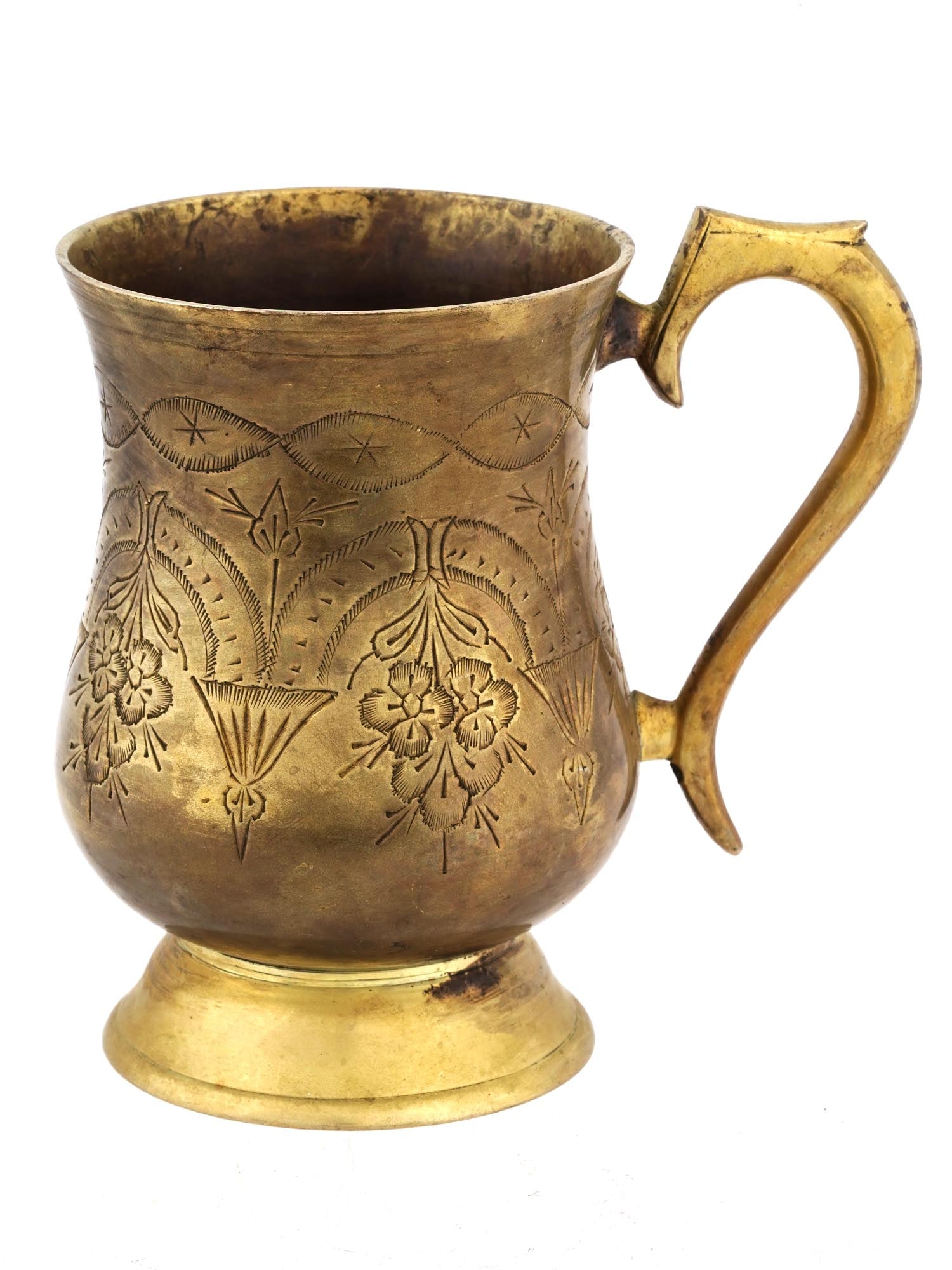 WWII NAZI GERMAN THIRD REICH AFRIKA KORPS BRASS MUG: A WWII model Nazi German Third Reich Afrika Korps, gilded brass mug. Raised on a base, the mug has a rounded shape with an engraved floral design and an overlaid oval depicting a Nazi German swastika,