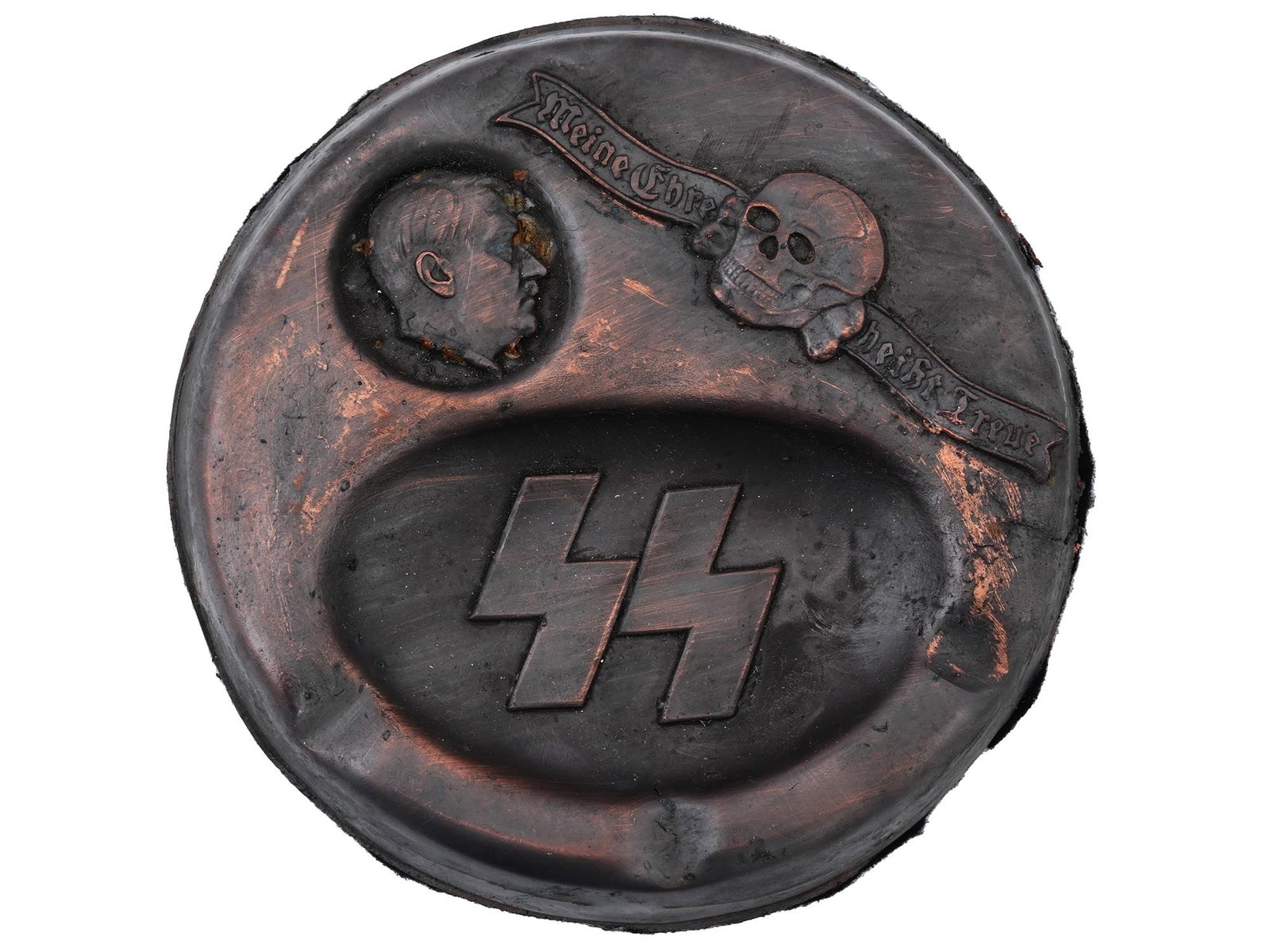 WWII NAZI GERMAN THIRD REICH ERA MODEL ASH TRAY: A pair of WWII Nazi German Third Reich model Waffen SS ashtrays. The ashtrays feature relief designs of a profile portrait of Hitler, a Totenkopf skull with the motto, and SS runes. Felt back. Unmarke