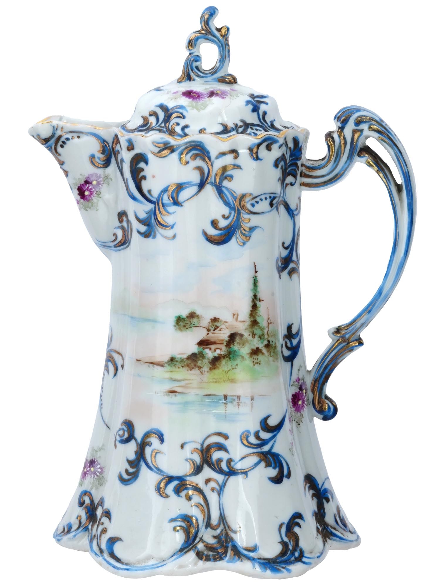 ANTIQUE NIPPON NPSK PAINTED PORCELAIN CHOCOLATE POT: An antique Bavarian Nippon NPSK hand painted porcelain hot chocolate pot. The exterior of the pot is adorned with medallions depicting a rural river landscape and flowers surrounded by a cobalt blue s