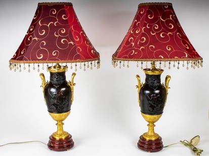 ANTIQUE 19 C FRENCH EMPIRE LAMPS BY LEON BOUCHER: An exquisite pair of antique 19th century Neoclassical French patinated and gilt bronze urns, lamps signed by Leon Boucher, 1868 to 1939. The collars with rows of pearls, the belly with bas-reliefs de