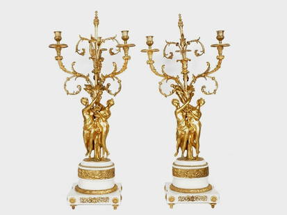 ANTIQUE 18TH C FRENCH ORMOLU AND MARBLE CANDELABRA: A pair of monumental antique French Louis XVI gilt bronze and Carrara marble candelabra. The figural stems of candelabras are modeled as three classically draped maidens supporting foliate scroll arms