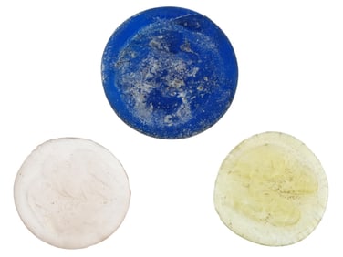 THREE ANCIENT ROUND GLASS TOKENS OF VARIOUS COLORS