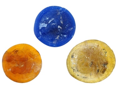 THREE ANCIENT ROUND GLASS TOKENS OF VARIOUS COLORS