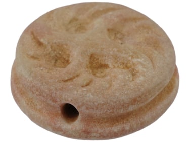 ANCIENT STONE BEAD FEATURING A HAND-CARVED DESIGN