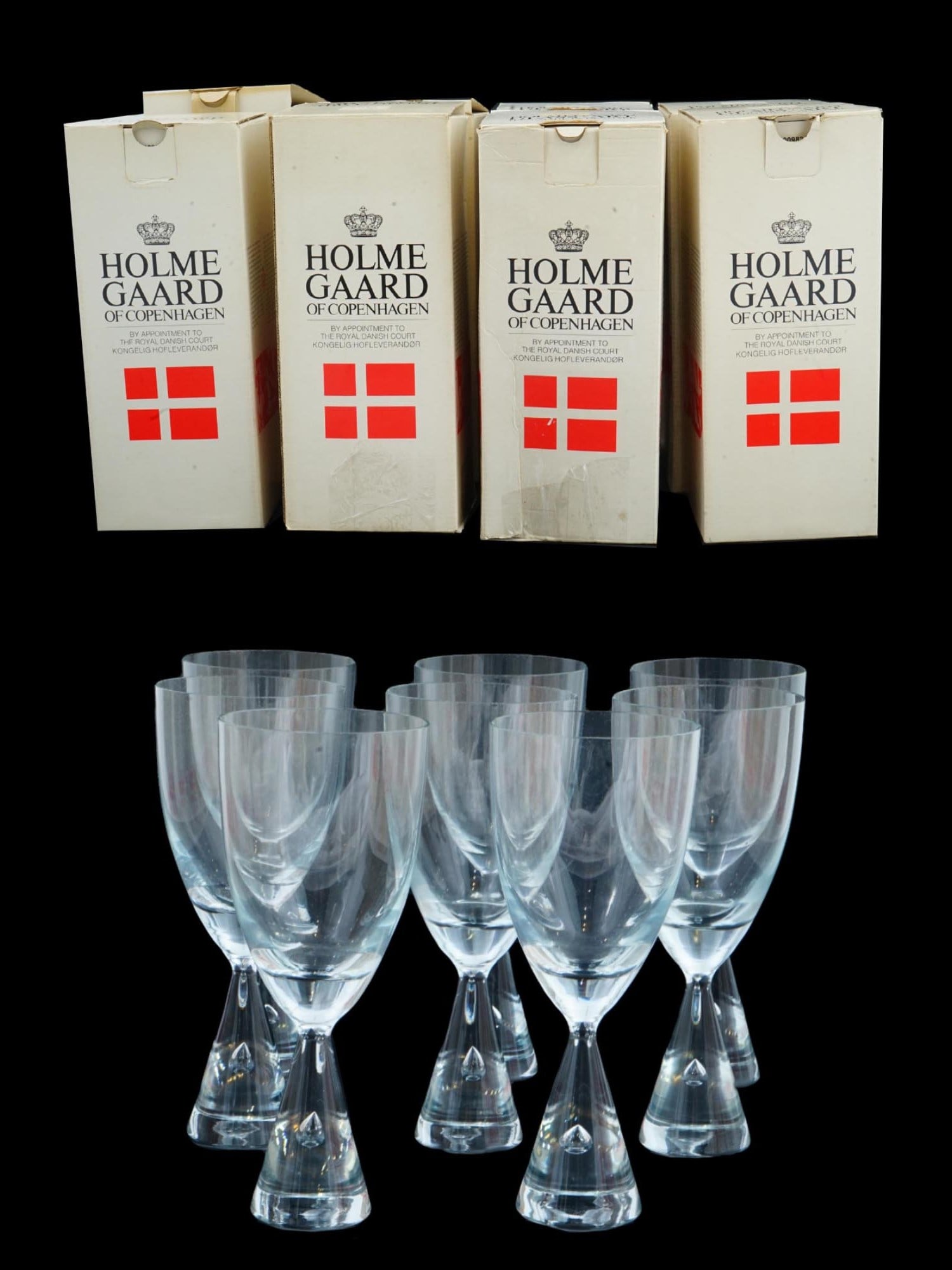 HOLMEGAARD PRINCESS GLASS WATER GOBLETS SET IOB: A set of vintage clear glass water goblets by Holmegaard Glass Factory, Denmark. Ca. 1986 to 1998. Princess collection. A total of 8 items. Air bubble stem of cone shape, no trim. Each glass comes in