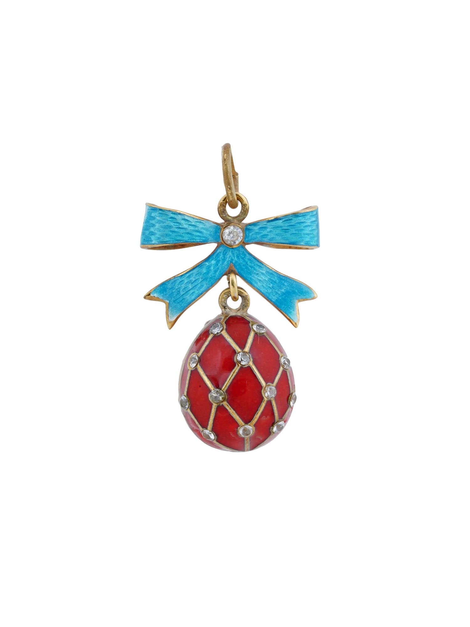RUSSIAN 84 GILT SILVER ENAMEL RED EGG PENDANT: A Russian 84 gilt silver and enamel pendant made in the shape of an Easter egg. The exterior of the egg is covered with red enamel over a guilloche ground and adorned with a lattice design set with ge