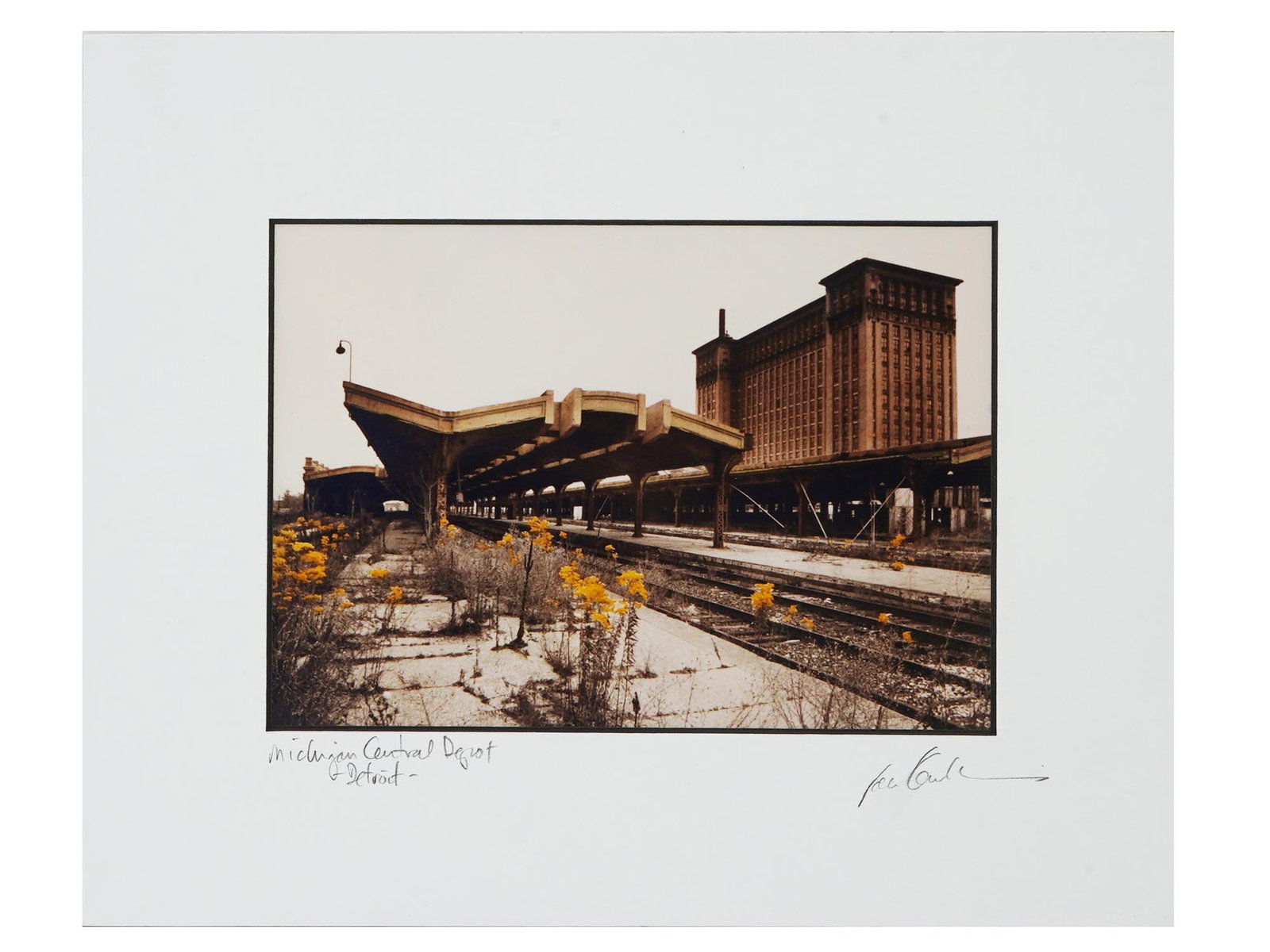 AMERICAN DETROIT HAND COLOR PHOTO BY JAN KAULINS: Jan Kaulins, a Contemporary American photographer, hand colored photograph, Michigan Central Depot Detroit. Signed lower right. Titled, lower left. Stamped on the backside. Circa: 1910 s to 1960s. Jan