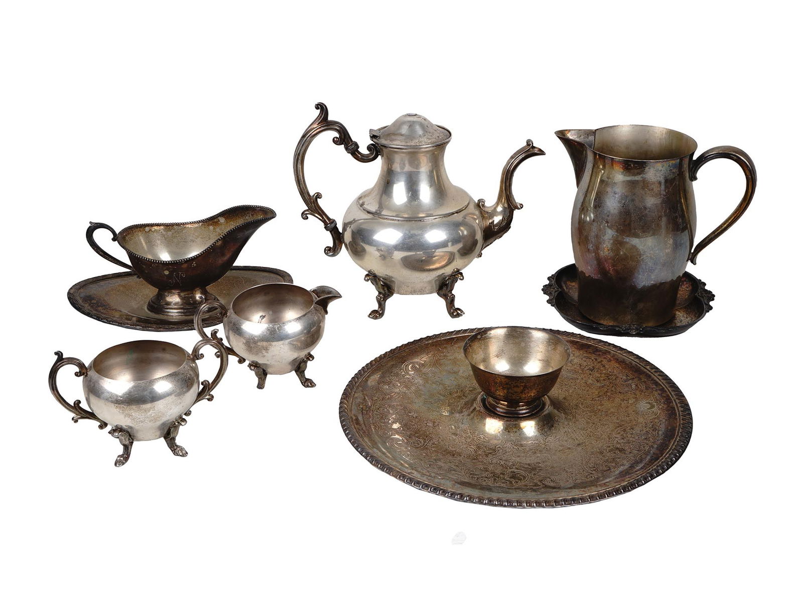 SILVER PLATED DINNERWARE AND SERVEWARE VINTAGE: A collection of vintage silverplate tableware items dated circa 1950s and 1960s. Includes a Paul Revere Reproduction water pitcher, marked on the bottom, a sauce bowl with an engraved letter N, a Geor