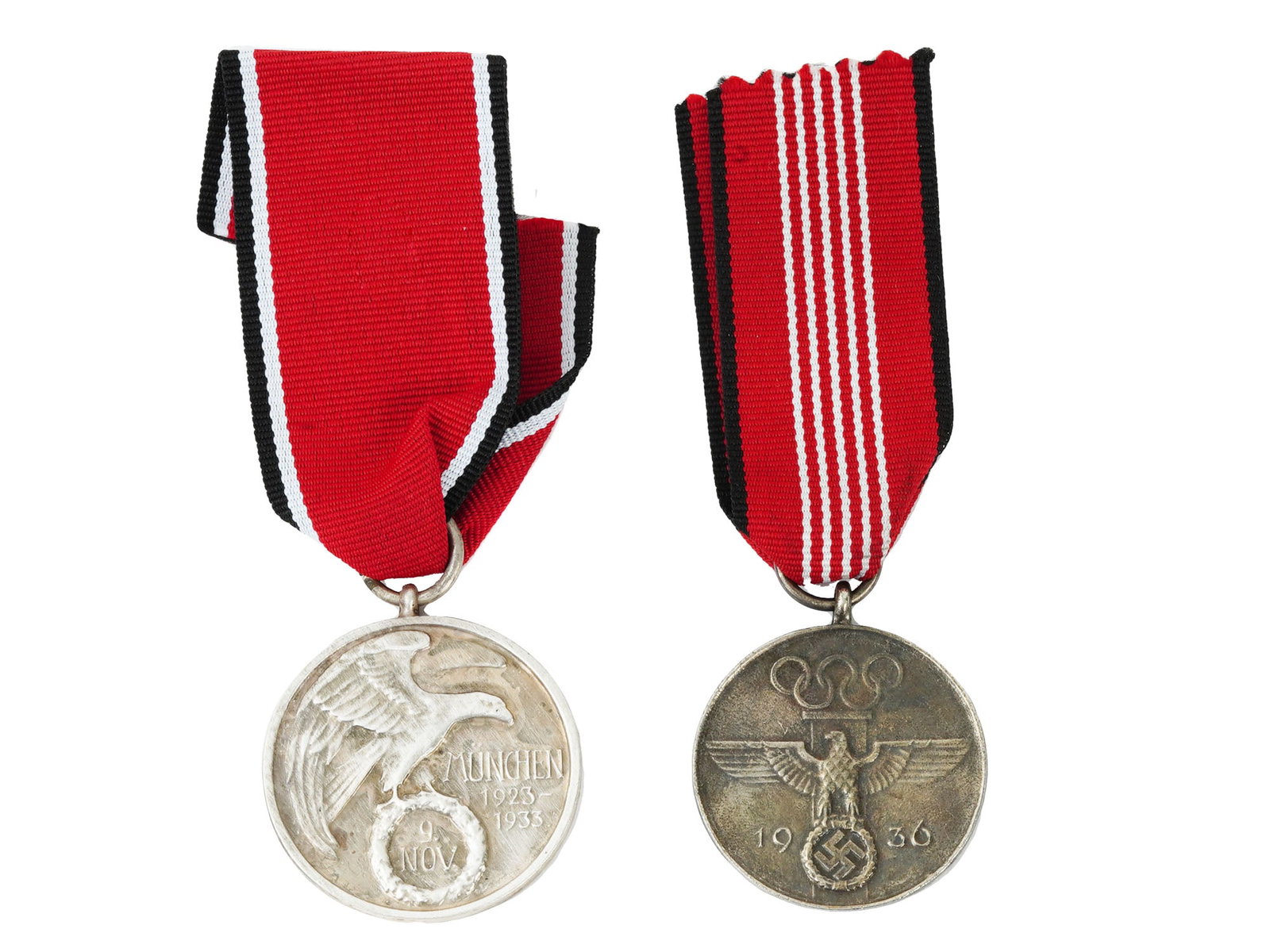 NAZI GERMAN 1936 OLYMPIC MEDAL AND BLOOD ORDER: A pair of 1930s Nazi German awards. First. 1936 Berlin Summer Olympic Games medal with ribbon. Inscription in German: Fur verdienstvolle Mitarbeit bei den Olympischen Spielen 1936, For meritorious ser
