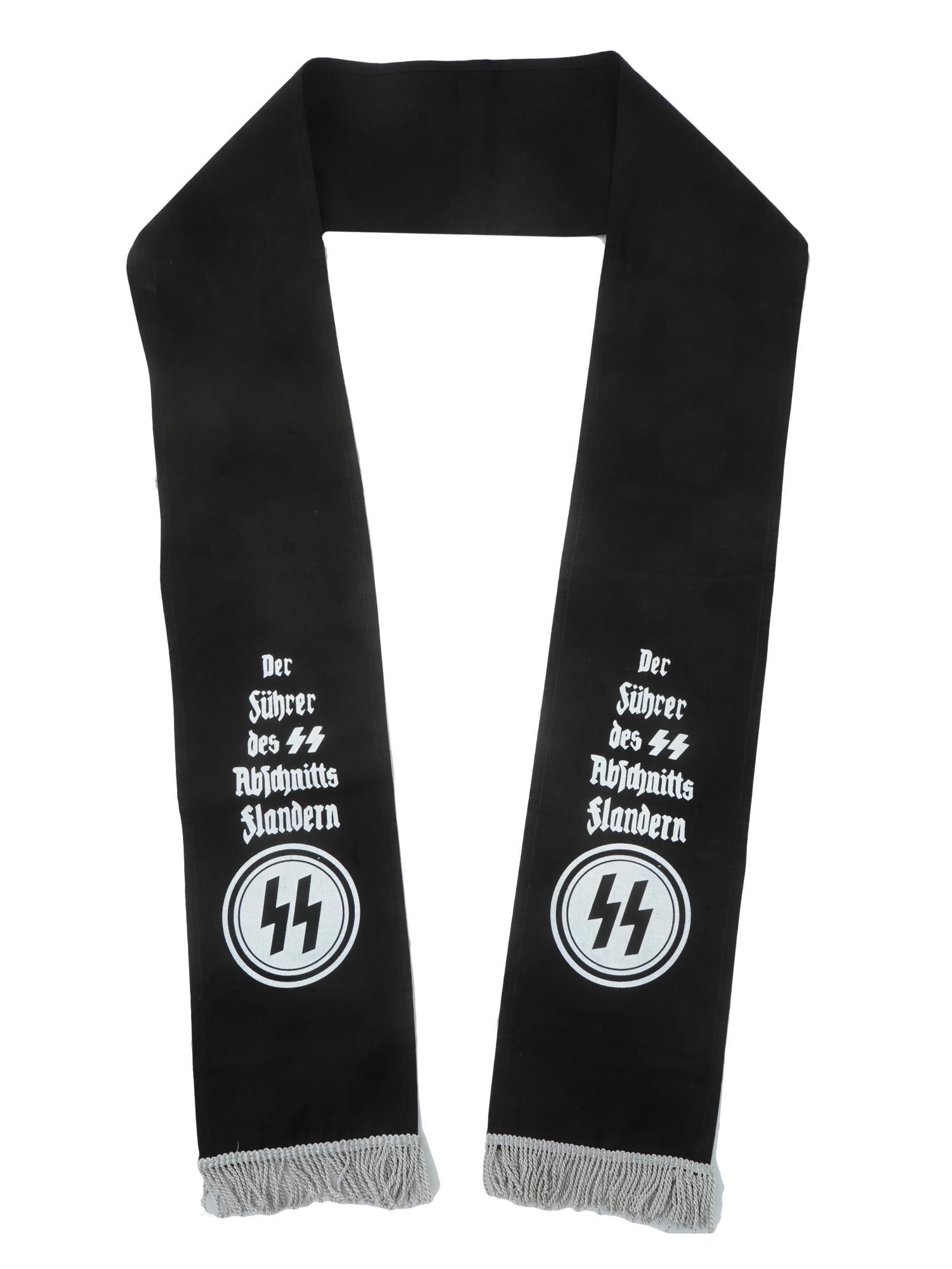 WWII GERMAN SS HIGH COMMAND CASKET FUNERAL SASH: A WWII German Waffen SS High Command Casket Funeral Sash. Black long fabric with silver fringe. The inscription in German is Der Fuhrer des SS Abfohnitts Flandern, which translates as The leader of th