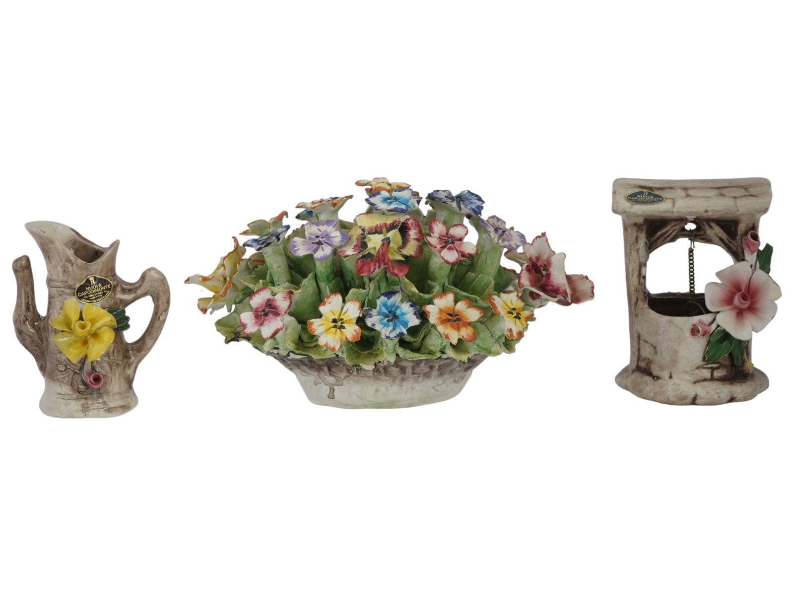 VINTAGE ITALIAN CAPODIMONTE PORCELAIN FIGURINES: A lot of three vintage hand-painted porcelain figurines by Capodimonte, an Italian porcelain manufacture based in Naples. A miniature flower pitcher, with original label sticker. A floral composition,