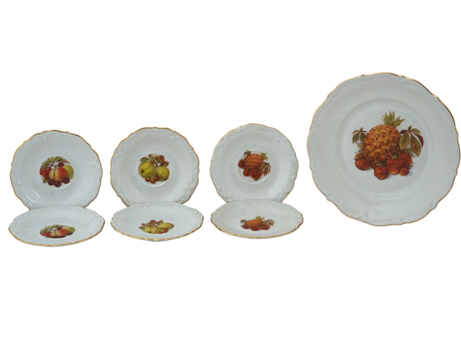 GERMAN BAVARIAN WINTERLING ROSLAU SERVING PLATES: A lot of seven vintage German Bavarian Winterling Roslau bone china serving plates. The lot includes one salad plate and six saucers. All items are white with a wavy gilded edge and images of various 