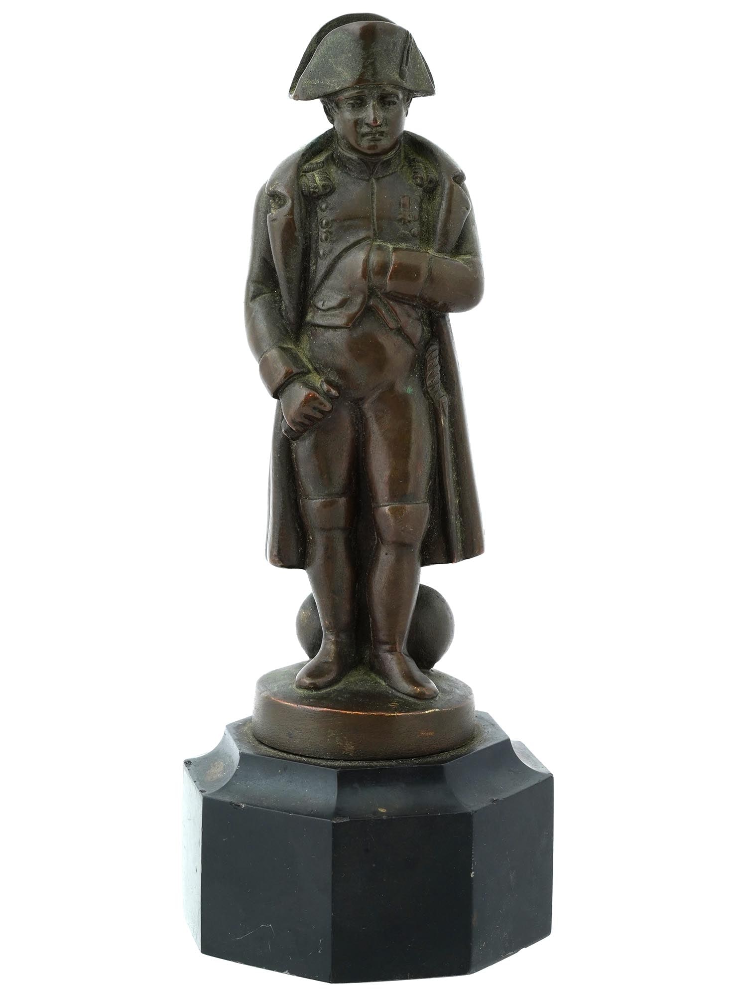 ANTIQUE CLASSICAL SCULPTURE NAPOLEON ON BATTLEFIELD: An antique classical sculpture depicting Napoleon on the battlefield in a contemplative pose, wearing a bicorne hat. Mounted on a carved marble base. Circa the late 19th and early 20th centuries. Anti