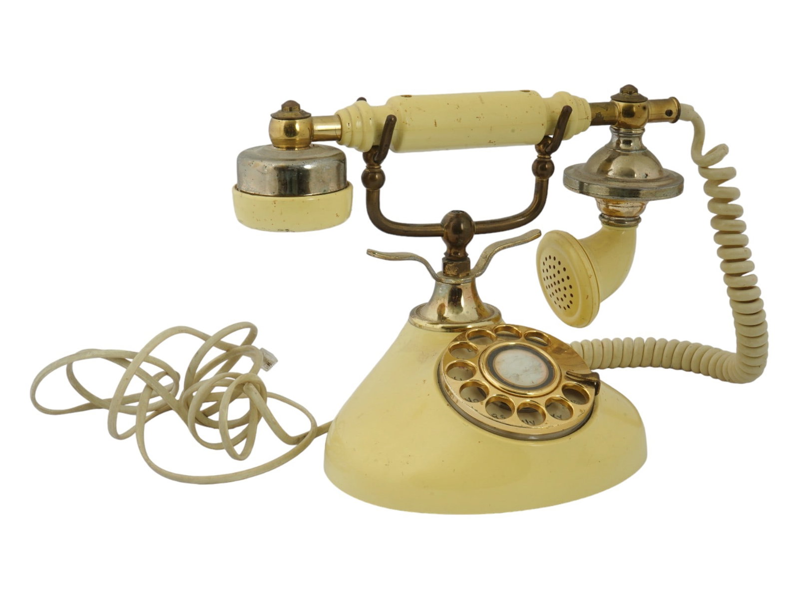 VINTAGE RADIO SHACK ROTARY PHONE IN VICTORIAN STYLE: A vintage Radio Shack rotary phone, designed in a Victorian style. Made in Korea, this phone features a cream tone body accented with brass details. The rotary dial, a hallmark of vintage telephones, 