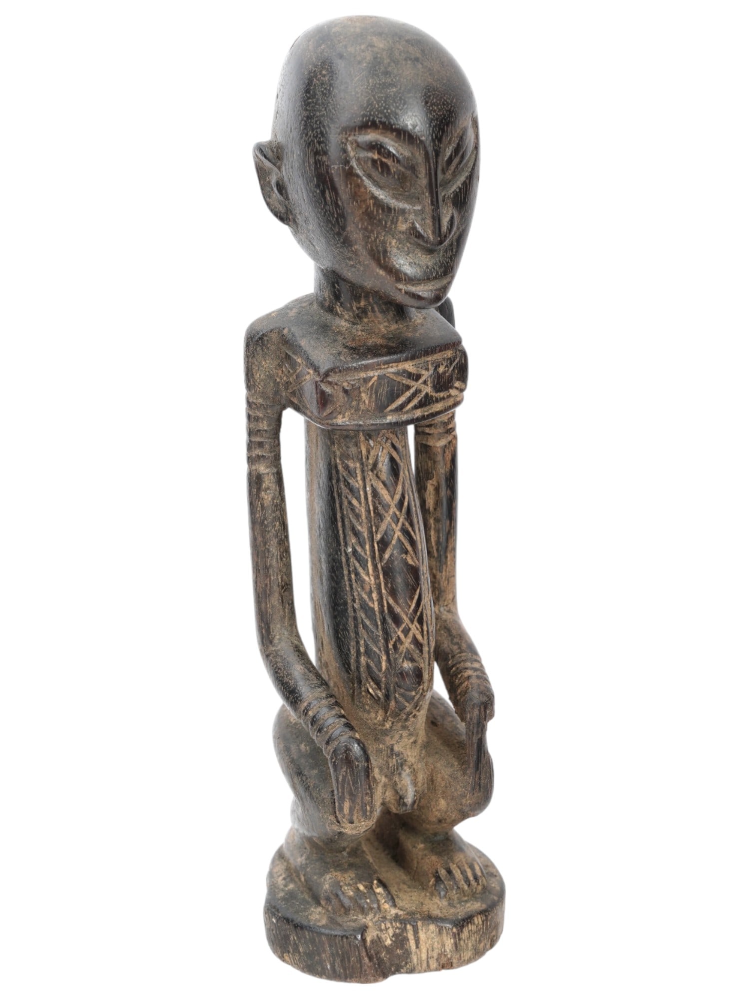 WEST AFRICAN MALI DOGON PEOPLE FUNERAL RITUAL SCULPTURE: A traditional West African Mali Dogon peoples funeral ritual sculpture. Crafted from wood with meticulous attention to detail, this sculpture features a prolonged and decorated body and elongated hand