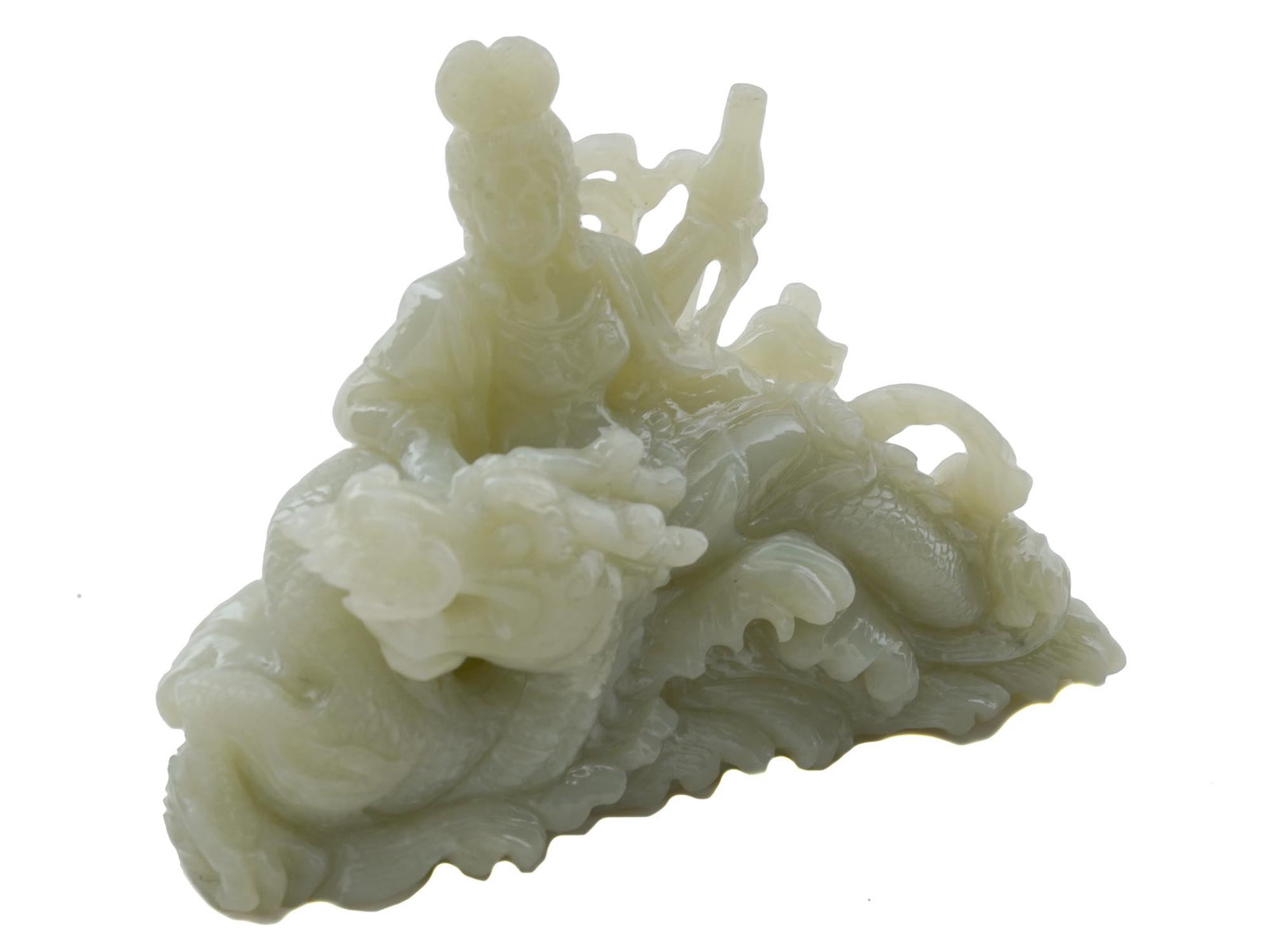 CHINESE CARVED SERPENTINE FIGURE OF GODDESS DRAGON: A vintage Chinese hand carved Serpentine stone sculpture. The sculpture represents Guanyin goddess with a dragon. The figure is adorned with engraved detailed patterns and pierced through elements. Ci