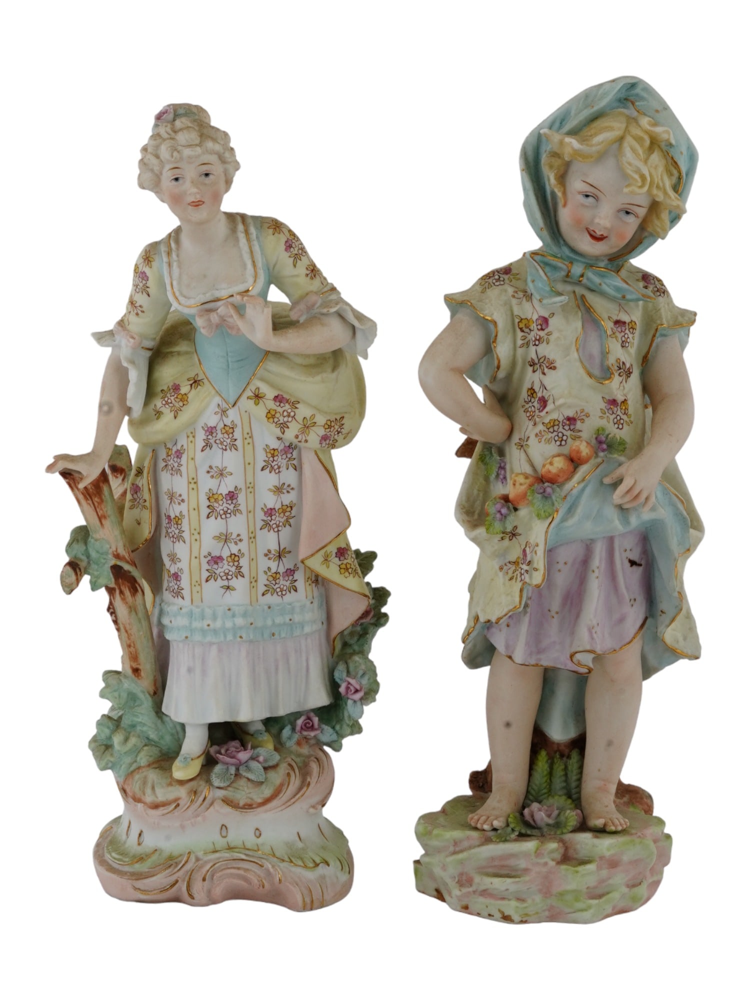 VINTAGE JAPANESE PORCELAIN FIGURINES MID 20TH C: A lot of two vintage Japanese porcelain figurines of a woman and a girl, circa mid 20th century. Both figures are hand painted and made in the style of the German porcelain manufacturer Goebel Hummel.