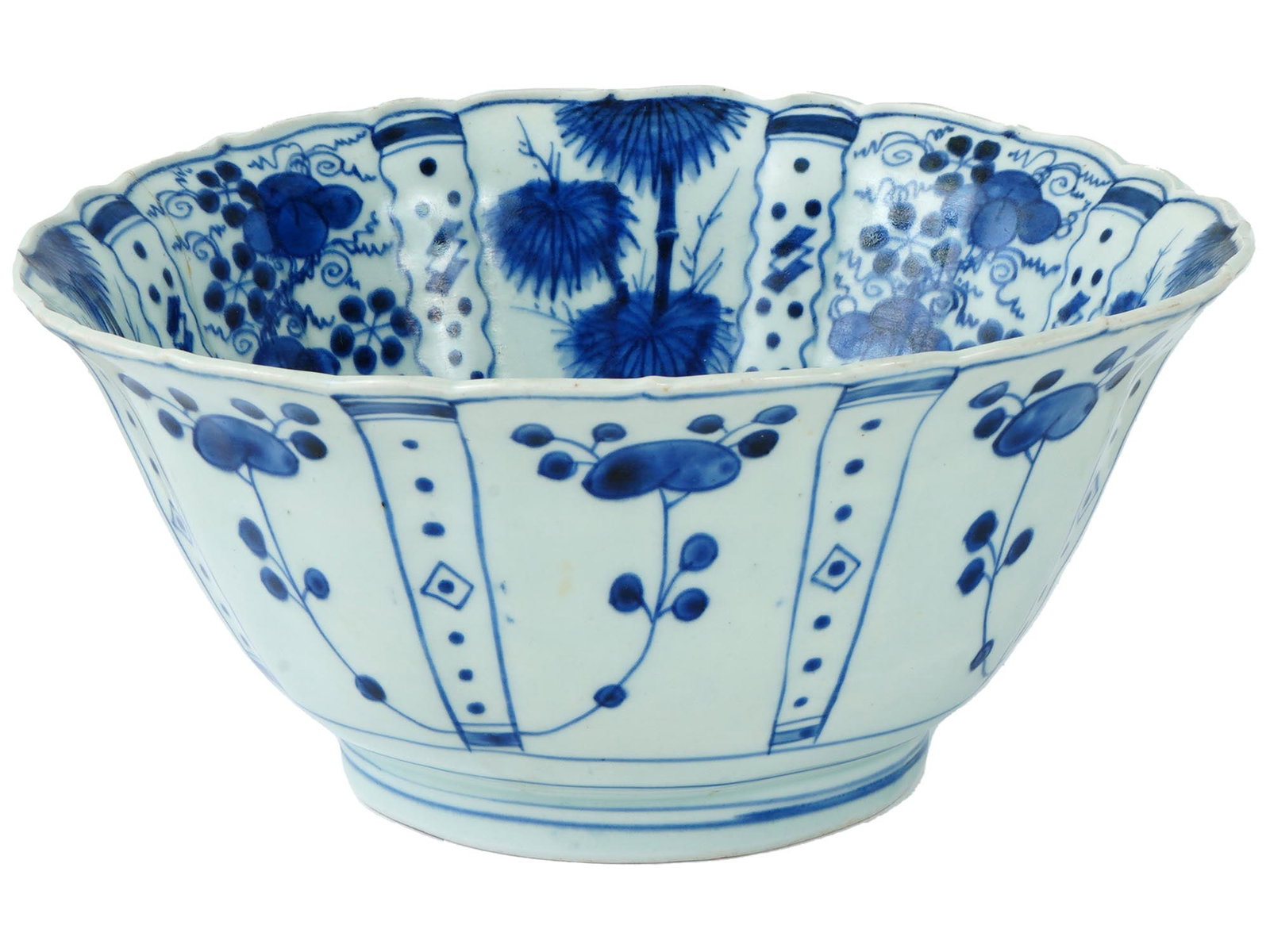 ANTIQUE CHINESE MING BLUE AND WHITE PORCELAIN BOWL: An antique Chinese, late Ming dynasty, blue and white porcelain bowl. The interior of the ware is adorned with an image of a bird in a landscape surrounded by panels representing floral and foliage or