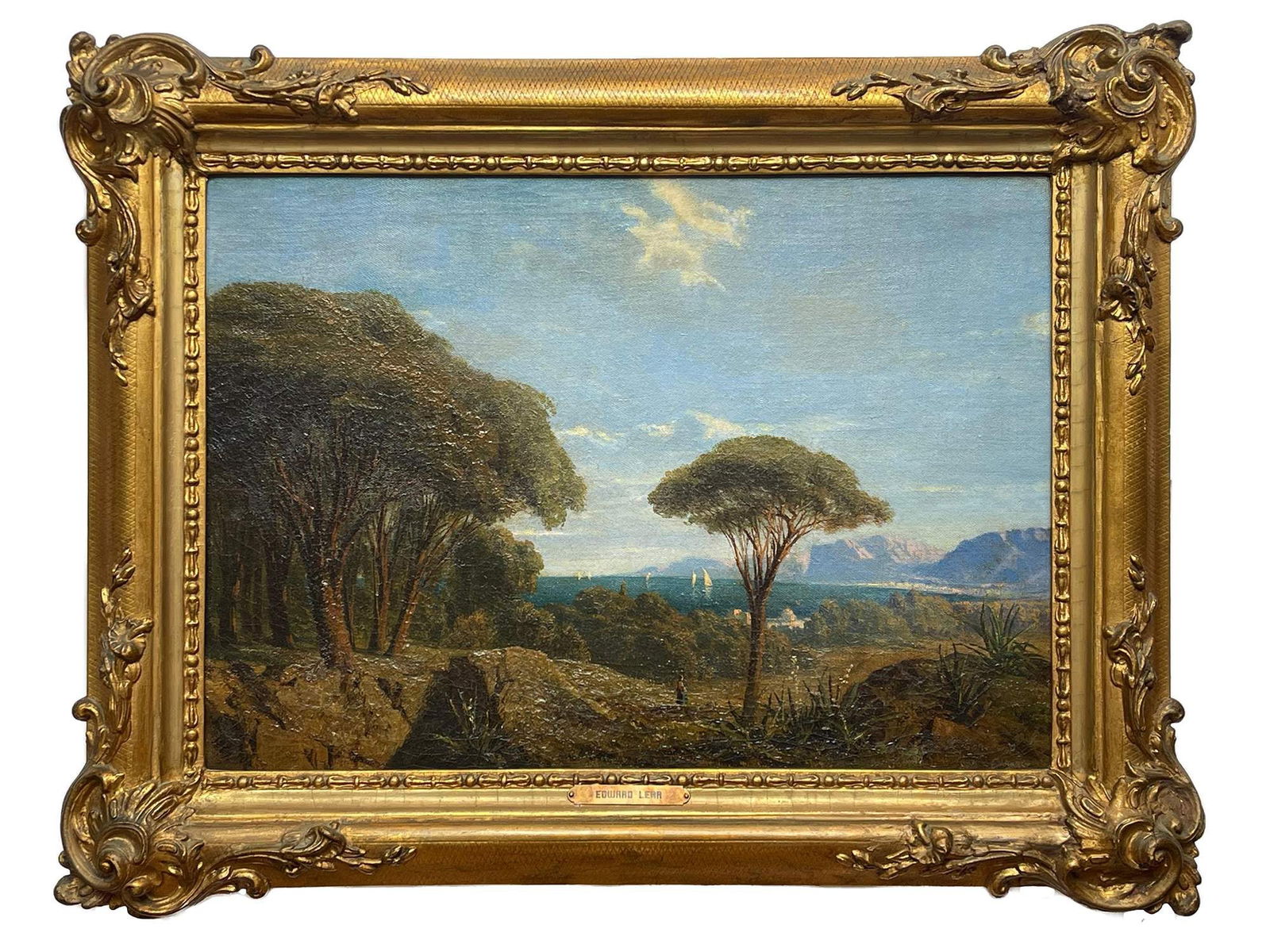 EDWARD LEAR ANTIQUE 19TH C ENGLISH OIL PAINTING: Edward Lear, English, 1812 to 1888, a Romanticism oil on canvas painting depicting a River Landscape. Housed in an original period gilt wood and gesso frame with carved scrolled foliage motifs and bea