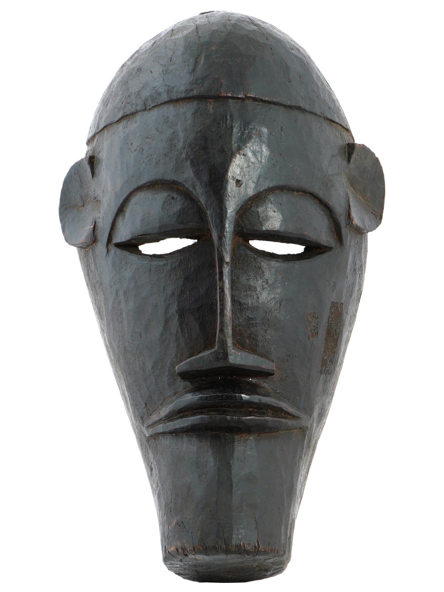 WEST AFRICAN DOGON PEOPLE WOODEN MASK FROM MALI: A West African Dogon wooden mask from Mali. The mask has an elongated oval face, narrow eyes, thin lips, and an elongated, thin nose. Holed on sides. The Dogon people, known for their unique artistic 