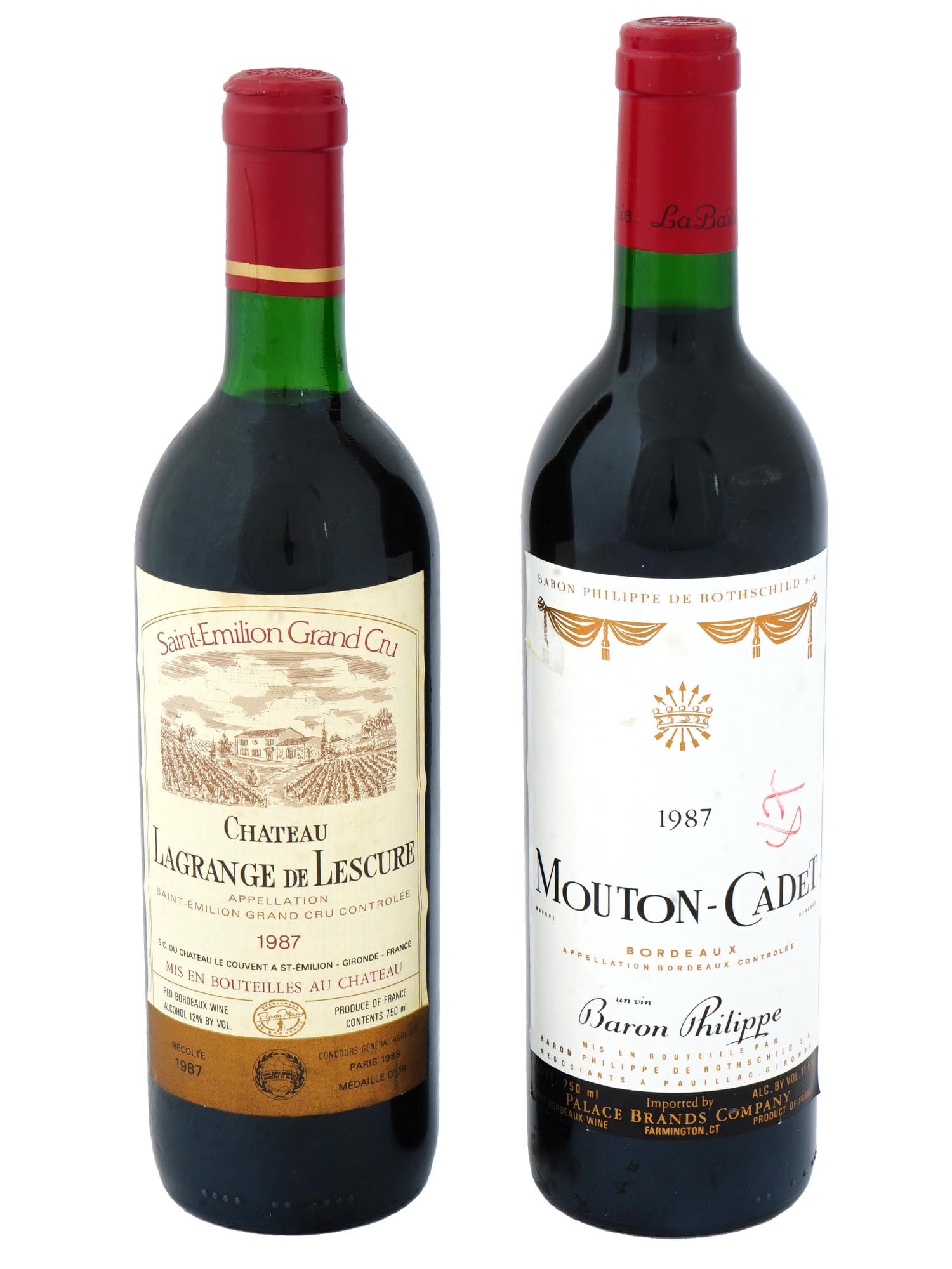 1987 CHATEAU LAGRANGE AND MOUTON CADET WINE BOTTLES: A lot of two 1987 bottles of red bordeaux wine. Chateau Lagrange de Lescure, Appelation Saint-Emilion Grand Cru, gold medal at the 1988 Concours general agricole. Mouton-Cadet, Appelation Bordeaux, Ba