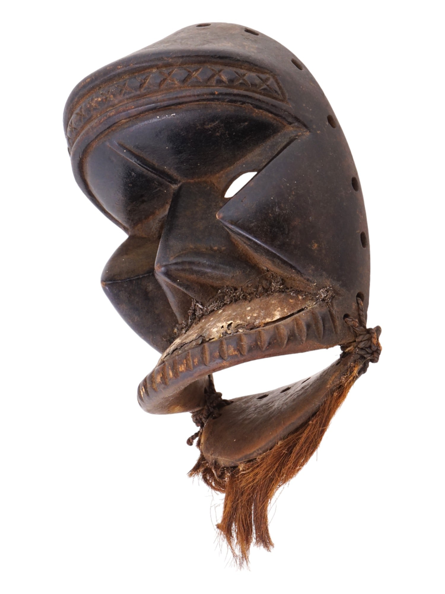 ANTIQUE AFRICAN CARVED WOOD MANDE TRIBAL DAN MASK: An antique traditional African hand carved wood tribal mask of the Dan people, a Mande ethnic group from northwestern Ivory Coast and neighboring Liberia. The oval face is depicted with narrow eyes, a