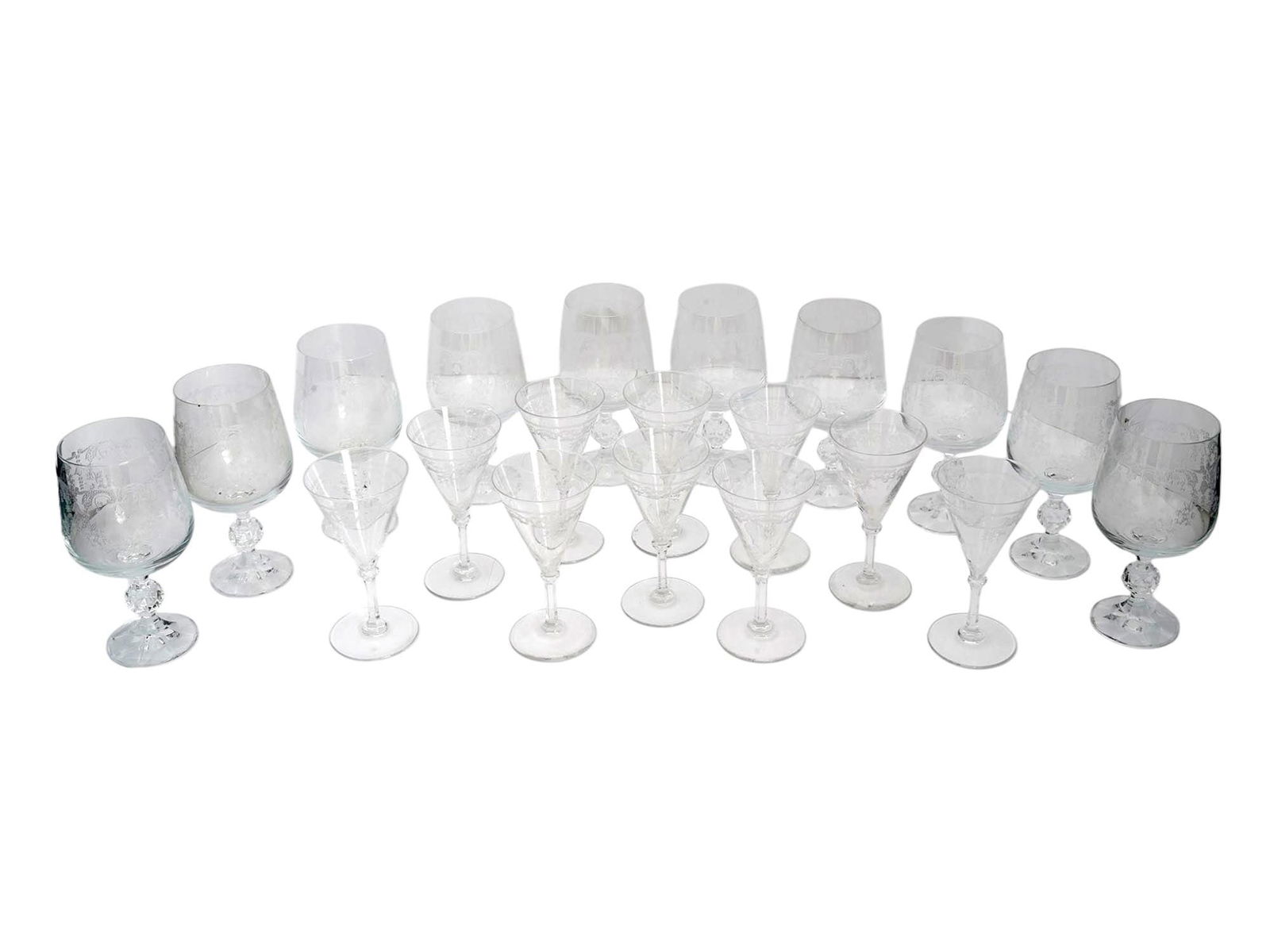 FRENCH LOUIS XV STYLE CRYSTAL WINE GLASSES SET: A lot of vintage French clear lead glass wine goblets. A total of 20 items including 10 red wine glasses and 10 sherry glasses. Etched ornamental decor, Louis XV style. Unmarked. Collectible Glassware